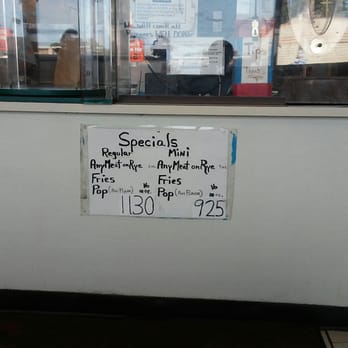 Lou's Deli - a sign in the window of a deli - Delis Near Me - Detroit, Michigan