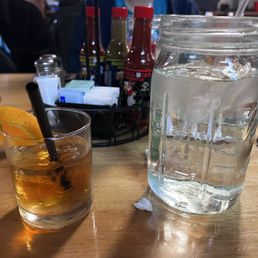 Old Fashion cocktail, outer store design, decorations.