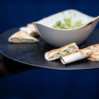 Taco Enzo At Lorenzo - a plate of quesadillas with a bowl of guacamole - Breakfast & Brunch Near Me - Dallas, Texas Taco Enzo At Lorenzo - a plate of quesadillas with a bowl of guacamole - Breakfast & Brunch Near Me - Dallas, Texas