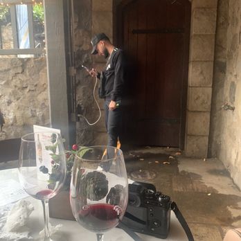 V Sattui Winery - Someone charging their phone and vaping in the corner near where we sat. - Wineries Near Me - Saint Helena, California V Sattui Winery - Someone charging their phone and vaping in the corner near where we sat. - Wineries Near Me - Saint Helena, California