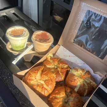 Bloom Bagels - Banana Matcha Latte (Iced), choc espresso, Chili Oil Scallion Bloom, garlic asiago, chorizo, and Corn Cheese Bloom - Bagels Near Me - Campbell, California Bloom Bagels - Banana Matcha Latte (Iced), choc espresso, Chili Oil Scallion Bloom, garlic asiago, chorizo, and Corn Cheese Bloom - Bagels Near Me - Campbell, California