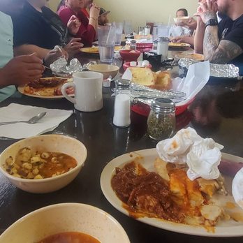 El Mirador - a group of people sitting at a table with plates of food - Mexican Near Me - Hobbs, New Mexico El Mirador - a group of people sitting at a table with plates of food - Mexican Near Me - Hobbs, New Mexico