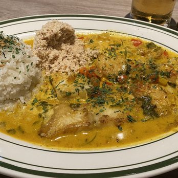 Basil Brazil Cuisine - Moqueca, fish stew with coconut milk, dense oil, bell pepper, onion, cilantro, tomato served with rice and farofa! - Brazilian Near Me - San Juan Capistrano, California