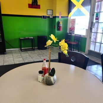 Jamaica Jerk Flavors - a table in a restaurant - Caribbean Near Me - Matteson, Illinois