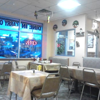 Mr Pollo - a dining area with tables and chairs - Latin American Near Me - Chicago, Illinois