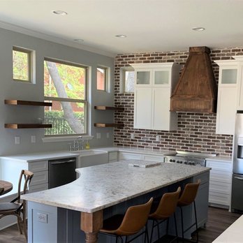 ADCO Stone and Interiors - Leathered White Ice granite was installed on the island, and Carrera White Quartz on the outer countertops. - Countertop Installation Near Me - Cedar Hill, Texas ADCO Stone and Interiors - Leathered White Ice granite was installed on the island, and Carrera White Quartz on the outer countertops. - Countertop Installation Near Me - Cedar Hill, Texas