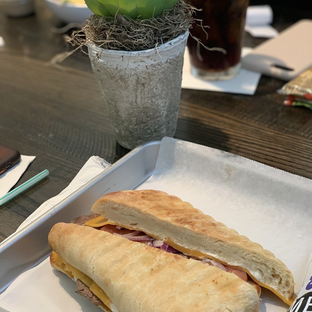 Refill Cafe - a sandwich and a drink on a table - Sandwiches Near Me - Jackson, Mississippi Refill Cafe - a sandwich and a drink on a table - Sandwiches Near Me - Jackson, Mississippi