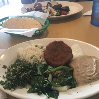 Zorba - Lamb Kabob (in the background), Pita (enough for 2) and Vegetarian Plate with rice pilaf, falafel, tzadziki sauce, tabouli and baba ganooj - Greek Near Me - Round Rock, Texas Zorba - Lamb Kabob (in the background), Pita (enough for 2) and Vegetarian Plate with rice pilaf, falafel, tzadziki sauce, tabouli and baba ganooj - Greek Near Me - Round Rock, Texas