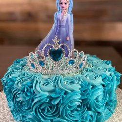 Meesht - Celebrate your bday like a princess!! A pink and purple doll cake. This cake was a fresh strawberry cake with fresh strawberry buttercream