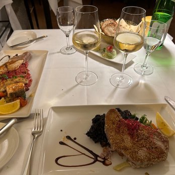 Restaurant Wasserfall - Grilled fish plate on the left. Tuna steak with local greens, center. Both ample portions and delicious. - Italian Near Me - Salzburg, 5 Restaurant Wasserfall - Grilled fish plate on the left. Tuna steak with local greens, center. Both ample portions and delicious. - Italian Near Me - Salzburg, 5