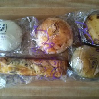 JJ Bakery - Clockwise from top - Steamed red been bun, Pineapple bun, German pudding, Onion mushroom bread and Green tea bun. - Bakeries Near Me - Torrance, California JJ Bakery - Clockwise from top - Steamed red been bun, Pineapple bun, German pudding, Onion mushroom bread and Green tea bun. - Bakeries Near Me - Torrance, California