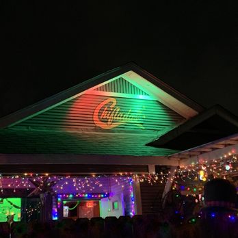 Chifladas - a house with christmas lights on the roof - Cocktail Bars Near Me - San Antonio, Texas