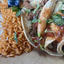Barbacoa tacos - three street tacos with a side of rice and beans Barbacoa tacos - three street tacos with a side of rice and beans