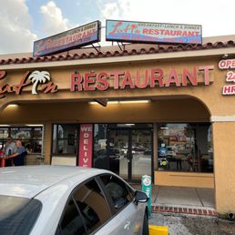 a car parked in front of the restaurant