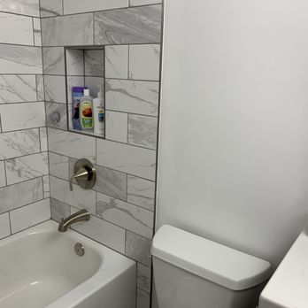 A Salas Construction Services - Shower/bath with niche and faucet in spare bath - General Contractors Near Me - Rockville, Maryland