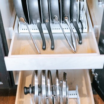 Hestia Homes - Pans and lids stored vertically - Home Organization Near Me