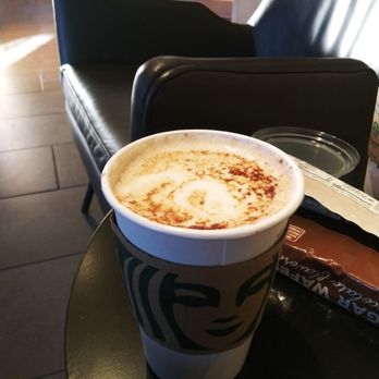 Starbucks - a cup of coffee on a table - Coffee & Tea Near Me - Gilbert, Arizona
