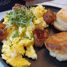 Scrambled eggs, bacon and biscuits