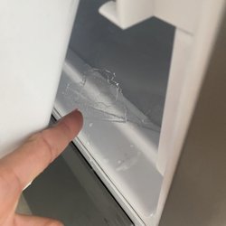 Denny's Appliance Sales & Service - Small piece I ripped up of the ice, the whole bottom freezer has a big sheet of ice. I paid and got no service.