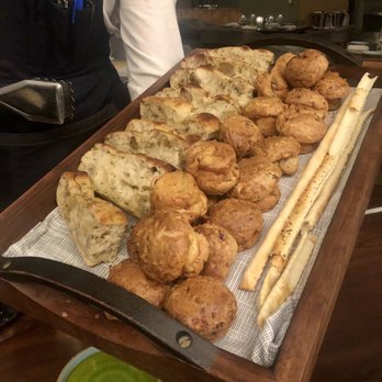 Yolan - Homemade bread selection with first press olive oil. - Italian Near Me - Nashville, Tennessee Yolan - Homemade bread selection with first press olive oil. - Italian Near Me - Nashville, Tennessee