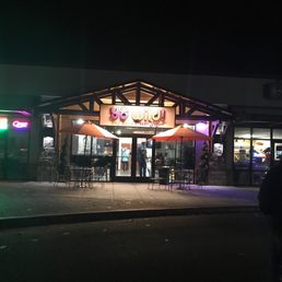 the outside of a restaurant at night