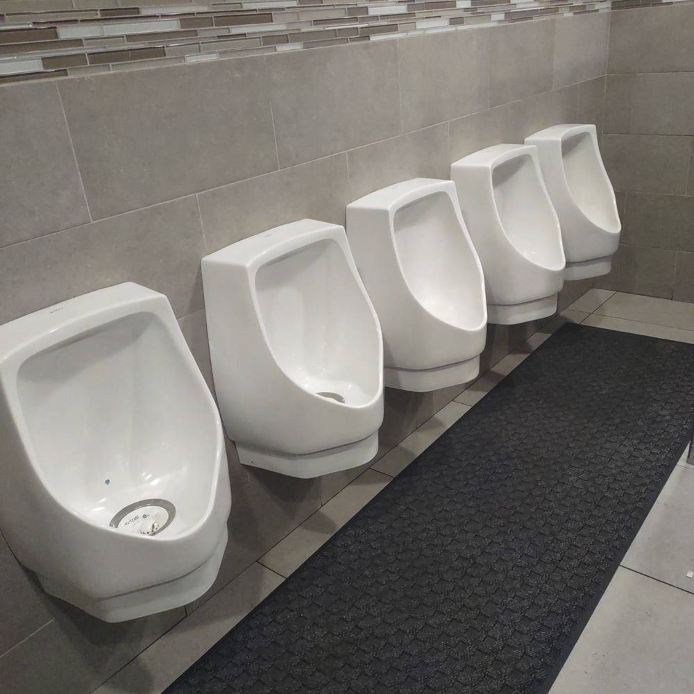Chelo's Waterfront Bar & Grille - Line of urinals without privacy dividers in the men's room at Chelo's on the Waterfront. - Seafood Near Me - Warwick, Rhode Island Chelo's Waterfront Bar & Grille - Line of urinals without privacy dividers in the men's room at Chelo's on the Waterfront. - Seafood Near Me - Warwick, Rhode Island