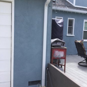 The Gutter Guys - Back of house into an existing drain - Gutter Services Near Me - Bellflower, California