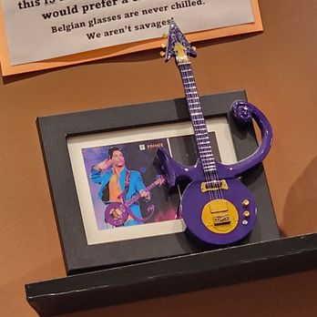 Disco Witch Brewing - a purple guitar on a shelf - Breweries Near Me - Yulee, Florida
