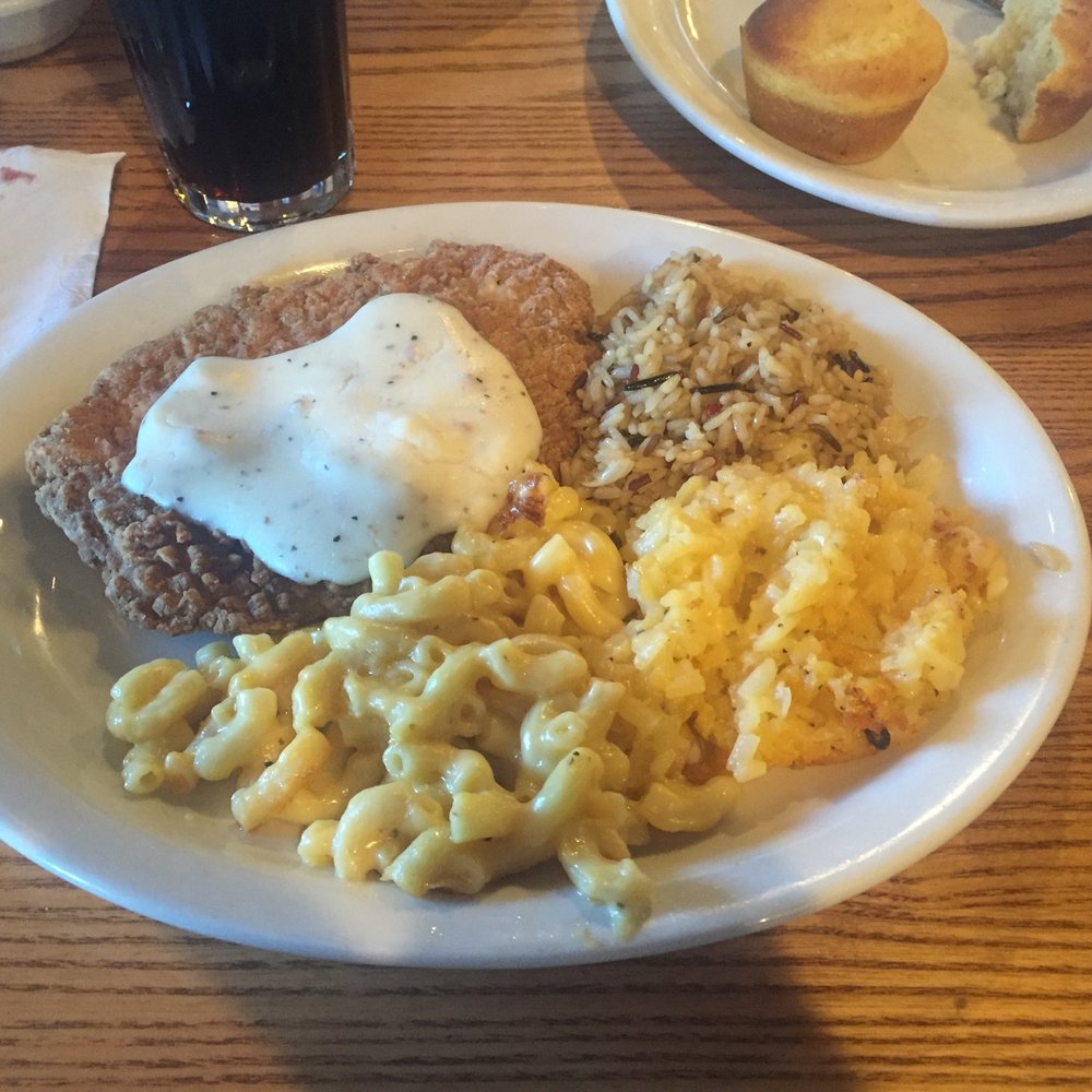 Cracker Barrel Old Country Store - Chicken fried chicken topped with sawmill gravy. Rice pilaf, mac and cheese, and hashbrown casserole. - Southern Near Me - Henderson, North Carolina