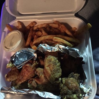 Coop Deville - My order of lemon pepper wings and fries (the lighting wasn't very good in this one) - New American Near Me - Jacksonville, Alabama