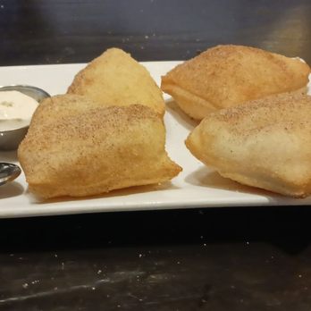 Pizza Rock - Zeppola-fried hollow inside pastry with caramel, chocolate, and citrus whipped cream. - Pizza Near Me - Henderson, Nevada Pizza Rock - Zeppola-fried hollow inside pastry with caramel, chocolate, and citrus whipped cream. - Pizza Near Me - Henderson, Nevada