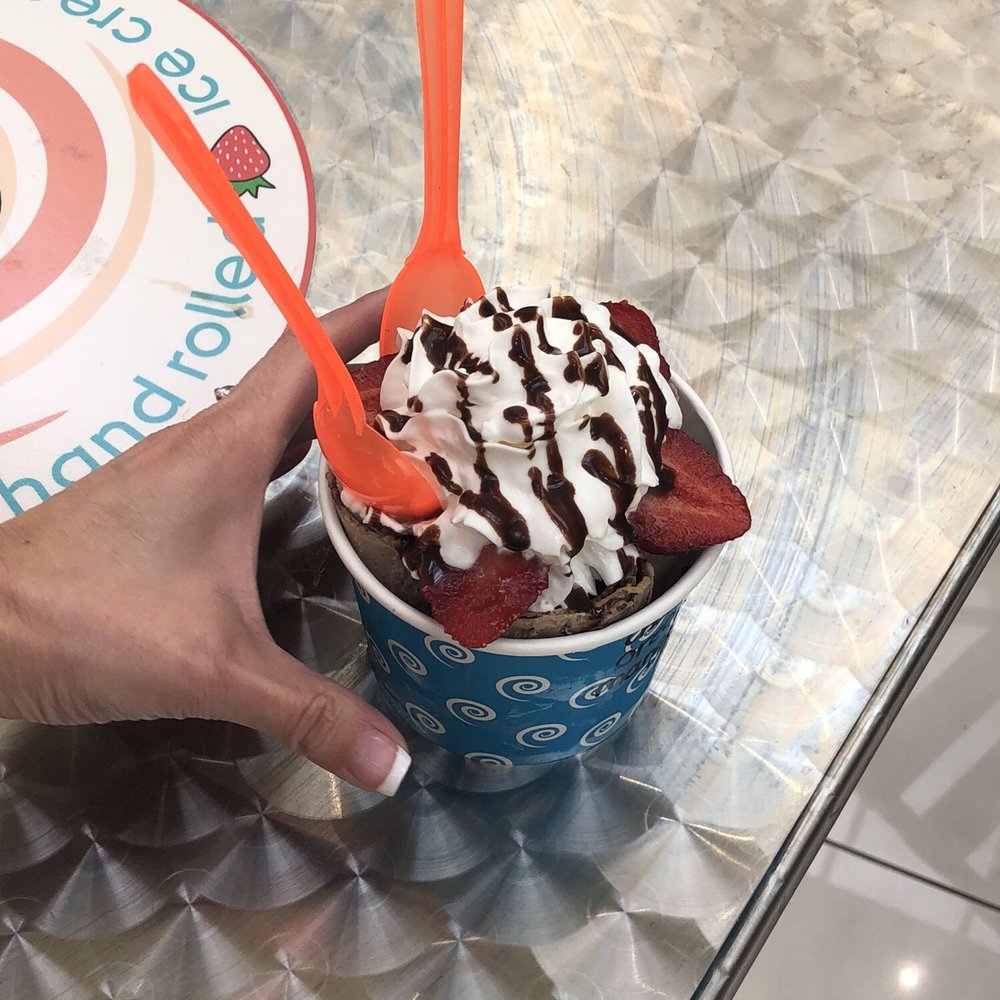 Arctic Smash - a hand holding a cup of ice cream and strawberries - Desserts Near Me - Poughkeepsie, New York