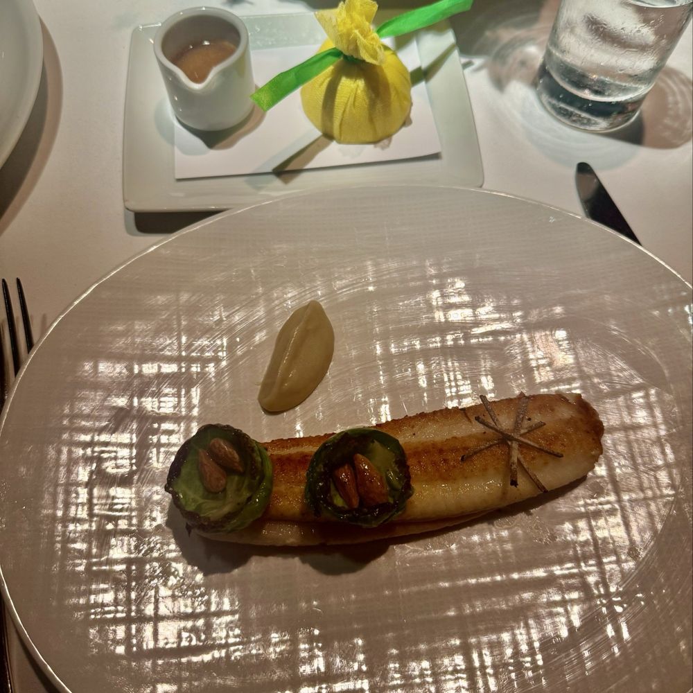 The River Café - Branzino with Brussels sprouts and almonds - New American Near Me - Brooklyn, New York The River Café - Branzino with Brussels sprouts and almonds - New American Near Me - Brooklyn, New York