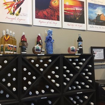 Westport Winery Tasting - wine bottles on display - Wine Tasting Room Near Me - Cannon Beach, Oregon Westport Winery Tasting - wine bottles on display - Wine Tasting Room Near Me - Cannon Beach, Oregon