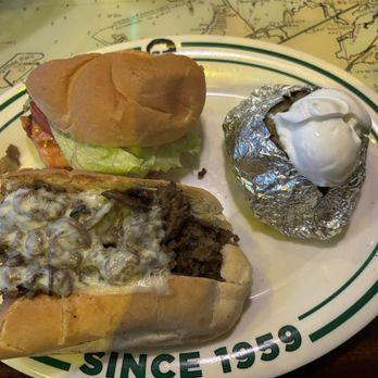 Flanigan's - Hollywood - 1/2 philly cheesesteak, 1/2 chicken breast sandwich (My own creation not on the menu. Totally should be an option.) with baked potato. - Seafood Near Me - Hollywood, Florida Flanigan's - Hollywood - 1/2 philly cheesesteak, 1/2 chicken breast sandwich (My own creation not on the menu. Totally should be an option.) with baked potato. - Seafood Near Me - Hollywood, Florida
