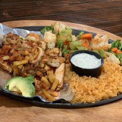 Avocado’s - Santa Fe Salmón- Grilled Salmón Topped with Grilled Shrimp & Pico De Mango. Served with Rice, Steamed Veggies & a Side Of Cilantro Ranch.