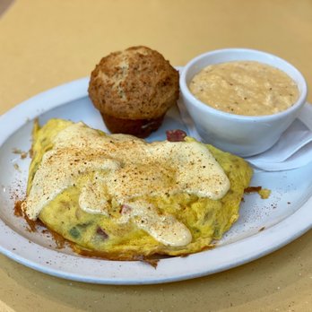 Wild Eggs - Creole omelette with grits of the day (cheddar) and the everything muffin $13.99 - Breakfast & Brunch Near Me - Louisville, Kentucky Wild Eggs - Creole omelette with grits of the day (cheddar) and the everything muffin $13.99 - Breakfast & Brunch Near Me - Louisville, Kentucky