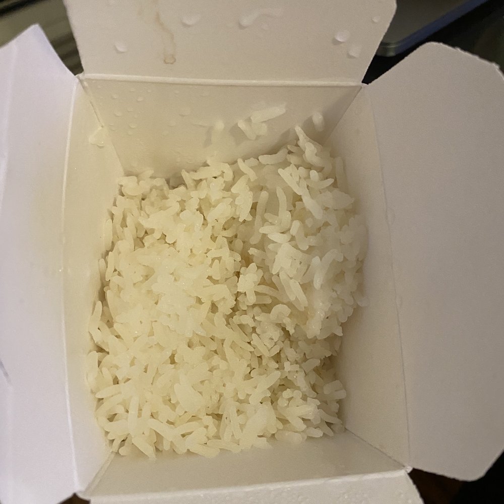 Pa De Thai Restaurant - A re-used carton of rice with sauce stains. - Thai Near Me - Edgewater, New Jersey Pa De Thai Restaurant - A re-used carton of rice with sauce stains. - Thai Near Me - Edgewater, New Jersey