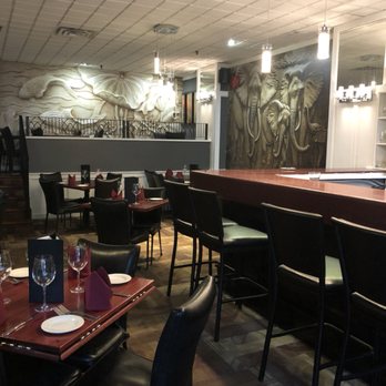 Select - a dining area with a bar and chairs - Indian Near Me - Edmonton, Alberta Select - a dining area with a bar and chairs - Indian Near Me - Edmonton, Alberta