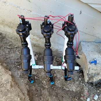 MJ Landscape - a couple of valves connected to a pipe - Landscaping Near Me MJ Landscape - a couple of valves connected to a pipe - Landscaping Near Me