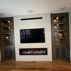 Gallery Of Fireplaces - Family room fireplace installed by gallery of fireplaces.  The cabinets were prepared by a separate cabinet maker.
