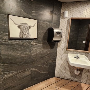 Great American Steakhouse - a bathroom with a sink and toilet - Burgers Near Me - El Paso, Texas Great American Steakhouse - a bathroom with a sink and toilet - Burgers Near Me - El Paso, Texas