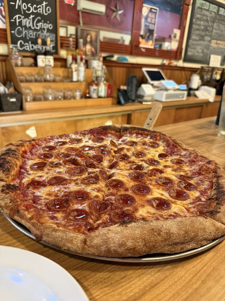 Carmine’s Pizza & Pasta Logo