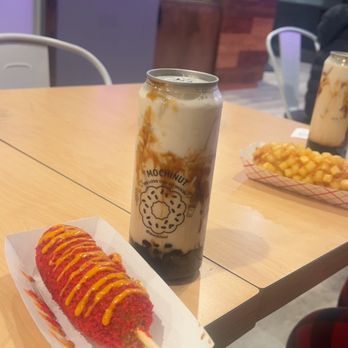Mochinut - hot cheeto half and half hotdog with brown sugar milk tea - Donuts Near Me - Katy, Texas