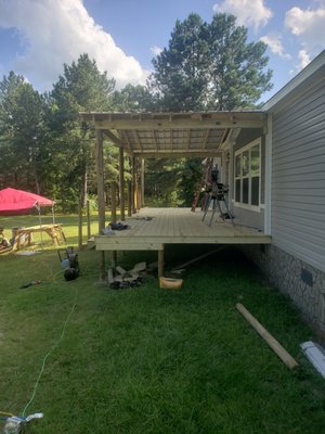Porch and roof addition Dublin GA. 2020 - this is a custom built project in Dublin GA, 2020. with the vision of the homeowner, her request for specific details we where able to build her what she wanted. deck, and gable fully designed and constructed Porch and roof addition Dublin GA. 2020 - this is a custom built project in Dublin GA, 2020. with the vision of the homeowner, her request for specific details we where able to build her what she wanted. deck, and gable fully designed and constructed