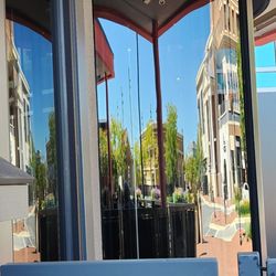 Urbano - Reflection in the revolving door--main entrance