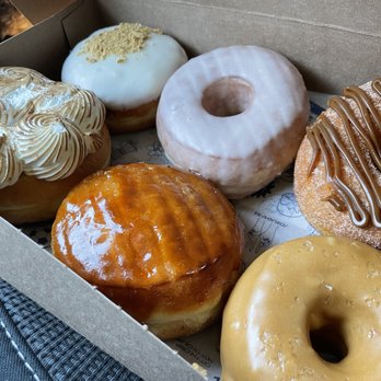 Doce Donut Co - Left to right:  Tres Leches, Guava con queso (yum!), Passion Fruit Creme Brulee, The OG (super yum!), Dulce de Leche, and Churro. - Donuts Near Me - Seattle, Washington
