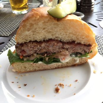 Cedric's Tavern - Half of an Estate Raised Pork Burger - Pubs Near Me - Asheville, North Carolina