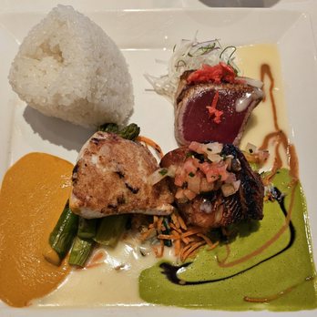 Roy's Hawaii Kai - Classic trio; misoyaki butterfish, macadamia crusted mahimahi, and blackened ahi. - Hawaiian Near Me - Honolulu, Hawaii Roy's Hawaii Kai - Classic trio; misoyaki butterfish, macadamia crusted mahimahi, and blackened ahi. - Hawaiian Near Me - Honolulu, Hawaii