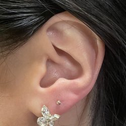 Lucky 13 Tattoos - Rose gold ear piercing.